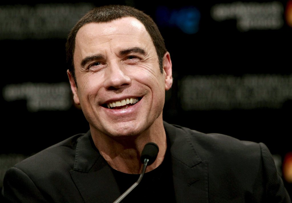 epa03407897 US actor John Travolta attend a press conference on his movie 'Savages' during the 60th Sebastian International Film Festival, in San Sebastian, Spain, 23 September 2012. The festival runs from 21 to 29 September.  EPA/JUAN HERRERO