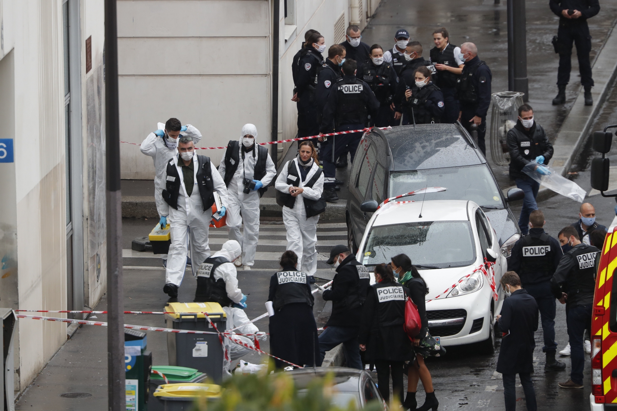 Police officers gather in the area of a knife attack near the former offices of satirical newspaper Charlie Hebdo, Friday Sept. 25, 2020 in Paris. Paris police say they have arrested a man suspected of a knife attack that wounded at least two people near the former offices of satirical newspaper Charlie Hebdo. Police initially thought there were two attackers but now say there was only one. (AP Photo/Thibault Camus) ArcInfo