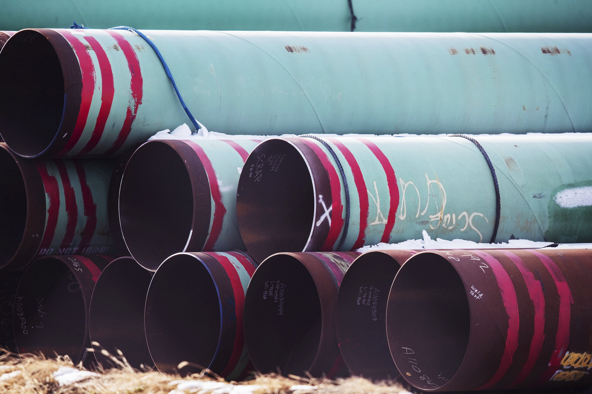 In this Dec. 18, 2020 photo, pipes to be used for the Keystone XL pipeline are stored in a field near Dorchester, Neb. Canadian Prime Minister Justin Trudeau says his officials have been in frequent contact with President-elect Joe BidenâÄ&#x2122;s incoming administration making the case for a long disputed oil pipeline that reports say Biden will cancel on his first day in office. (Chris Machian /Omaha World-Herald via AP)