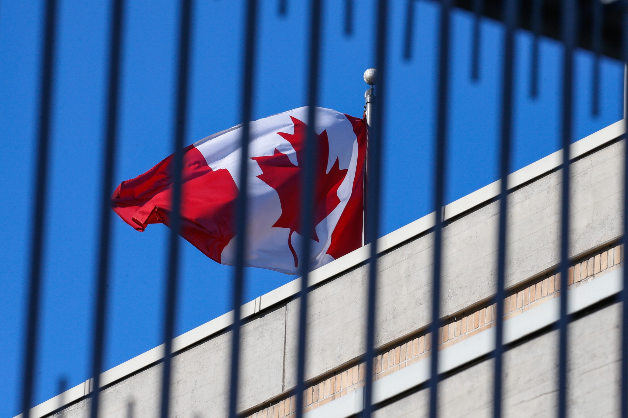 epa09407775 (FILE) - A Canadian flag flies at the Canadian embassy in Beijing, China, 15 January 2019 (reissued 10 August 2021). On 10 August 2021, A Chinese court upheald the death sentence for Robert Lloyd Schellenberg, a Canadian man who was accused of smuggling drugs in China in 2014. EPA/ROMAN PILIPEY