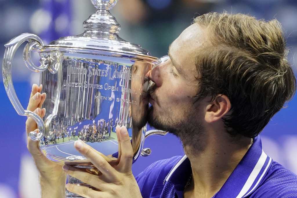 Daniil Medvedev, of Russia, kisses the championship trophy after defeating Novak Djokovic, of Serbia, in the men's singles final of the US Open tennis championships, Sunday, Sept. 12, 2021, in New York. (AP Photo/John Minchillo)