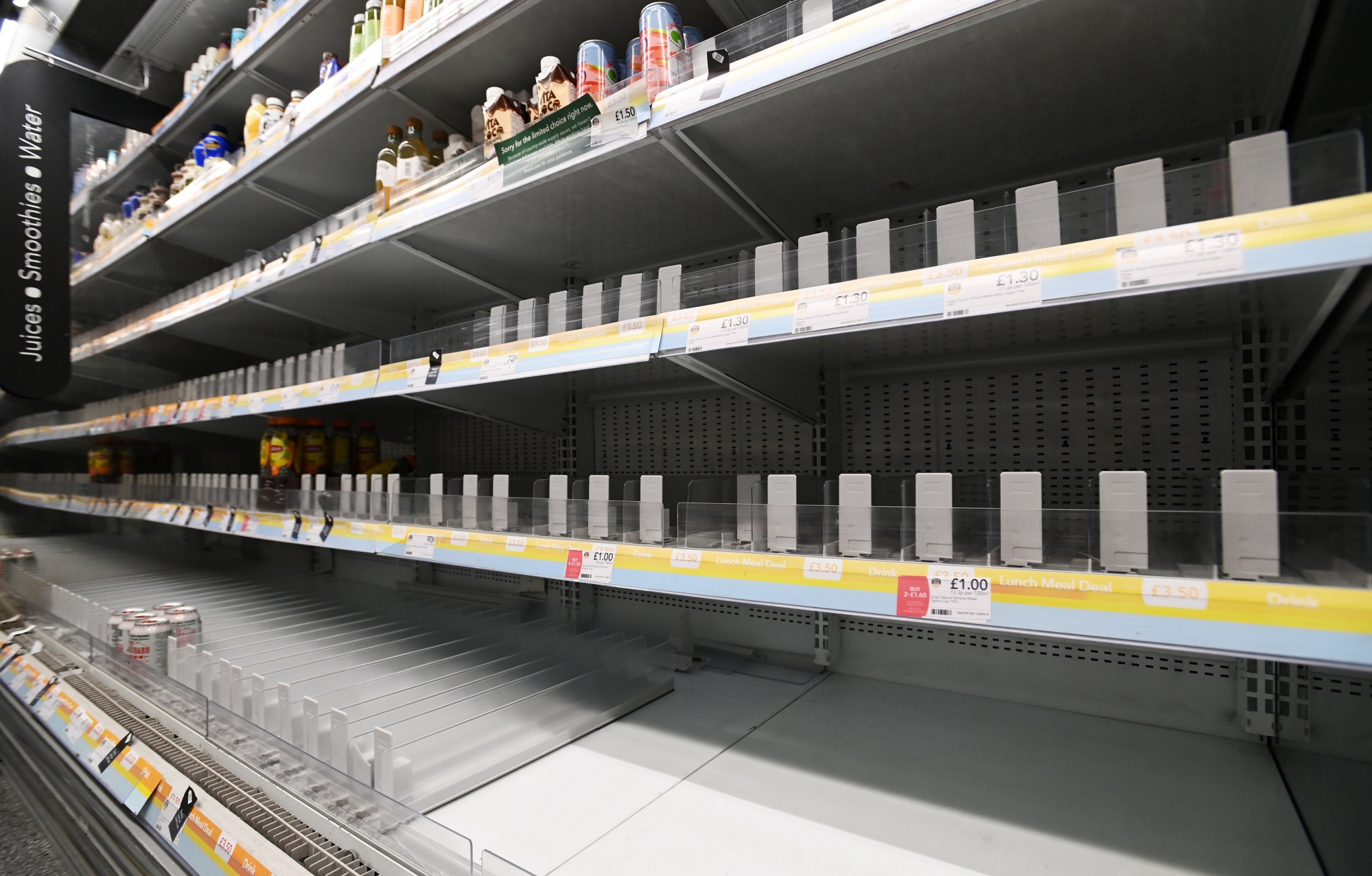 epa09430559 Bare shelves at a supermarket in central London, Britain, 26 August 2021. The shortage of lorry drivers has left supermarkets and restaurants short of produce across the UK. Nando's and McDonald's has been hit by supply chains in recent days. Brexit and the Covid pandemic has meant there aren't enough lorry drivers to meet the demand. EPA/ANDY RAIN