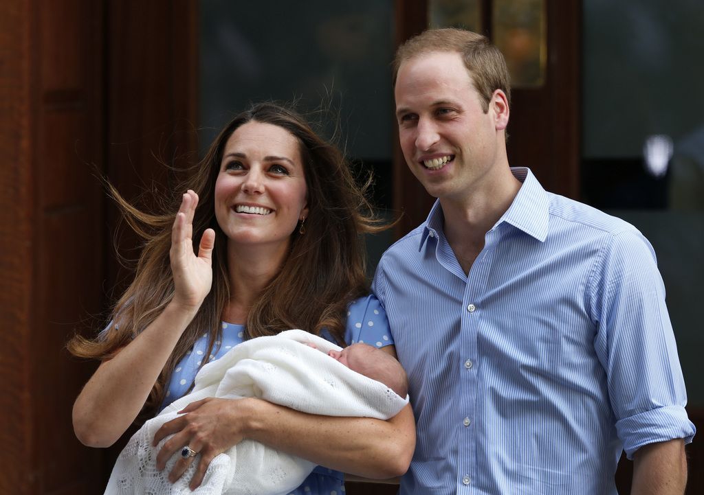 Britain's Prince William and Kate, Duchess of Cambridge hold the Prince of Cambridge, Tuesday, July 23, 2013, as they pose for photographers outside St. Mary's Hospital exclusive Lindo Wing in London where the Duchess gave birth on Monday, July 22. The Royal couple left the hospital to head to London?s Kensington Palace with their newly born son, the third in line to the British throne. (AP Photo/Lefteris Pitarakis)