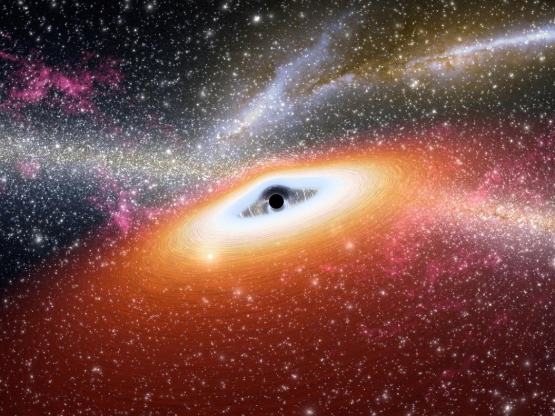 Le trou noir découvert engloutit l'équivalent d'une Terre chaque seconde et éclaire 7000 fois plus que toute la lumière de notre Voie lactée (illustration).