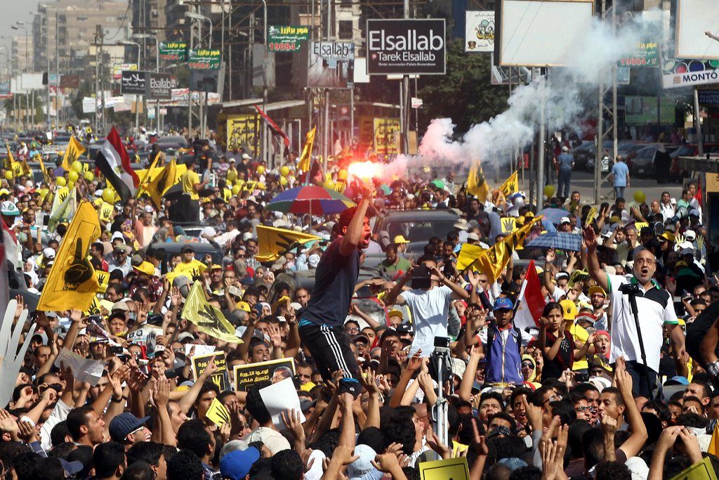 epa03896034 Egyptian supporters of ousted President Mohamed Morsi shout slogans during a protest in Cairo, Egypt, 04 October 2013. Morsi's Muslim Brotherhood has condemned his toppling on 03 July as a coup and vowed to continue protests until he is restored to power.  EPA/KHALED ELFIQI