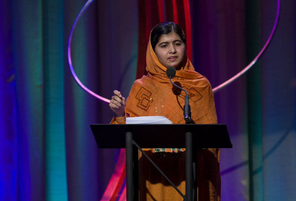 In this photo taken Wednesday, Sept. 25, 2013, Malala Yousafzai, the Pakistani teenager shot by the Taliban for promoting education for girls, speaks after receiving the Leadership in Civil Society at the Clinton Global Initiative's Citizen Awards Dinner in New York. (AP Photo/Craig Ruttle)