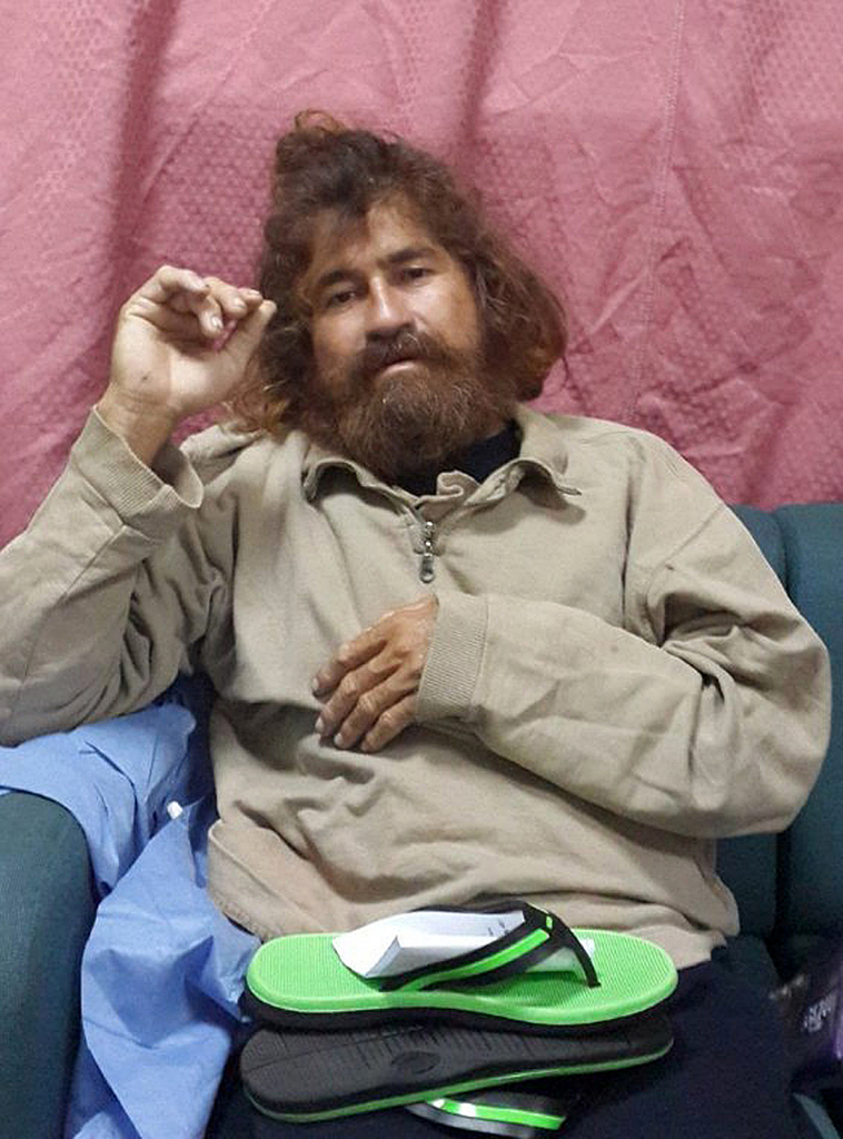 In this Monday, Feb. 3, 2014 photo provided by the Marshall Islands Foreign Affairs Department, a man identifying himself as 37-year-old Jose Salvador Alvarenga sits on a couch in Majuro in the Marshall Islands, after he was rescued from being washed ashore on the tiny atoll of Ebon in the Pacific Ocean.  Alvarenga told the U.S. ambassador in the Marshall Islands Tom Armbruster and the nation's officials that he left Mexico in December 2012 for a day of shark fishing and ended up surviving 13 months on fish, birds and turtles before washing ashore on the remote Marshall Islands thousands of miles (kilometers) away. (AP Photo/Foreign Affairs Department The Marshall Islands, Gee Bing)