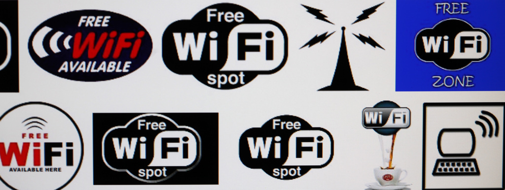 In this April 21, 2011 photo, Wi-Fi logos are shown on a computer screen search engine in Buffalo, N.Y.  The poll conducted for the Wi-Fi Alliance, the industry group that promotes wireless technology standards, found that 32 percent of respondents acknowledged trying to access a Wi-Fi network that wasn?t theirs. An estimated 201 million households worldwide use Wi-Fi networks, according to the alliance. The same study, conducted by Wakefield Research, found that 40 percent said they would be more likely to trust someone with their house key than with their Wi-Fi network password. (AP Photo/David Duprey)