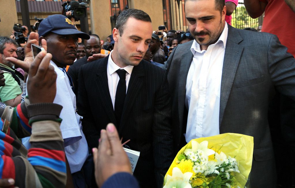 Oscar Pistorius leaves the high court in Pretoria, South Africa, Friday, April 11, 2014. Pistorius is charged with the murder of his girlfriend Reeva Steenkamp, on Valentines Day in 2013. (AP Photo/Themba Hadebe)