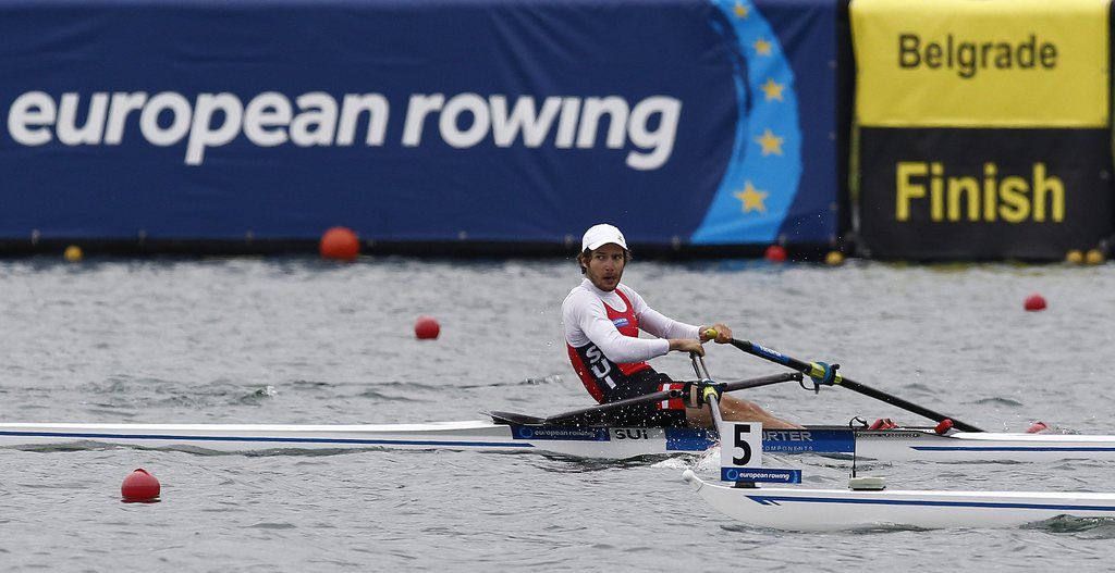epa04233634 Switzerland's Michael Schmid competes in the Lightweight Single Sculls semifinal at the European Rowing Championships in Belgrade, Serbia, 31 May 2014.  EPA/IVAN MILUTINOVIC
