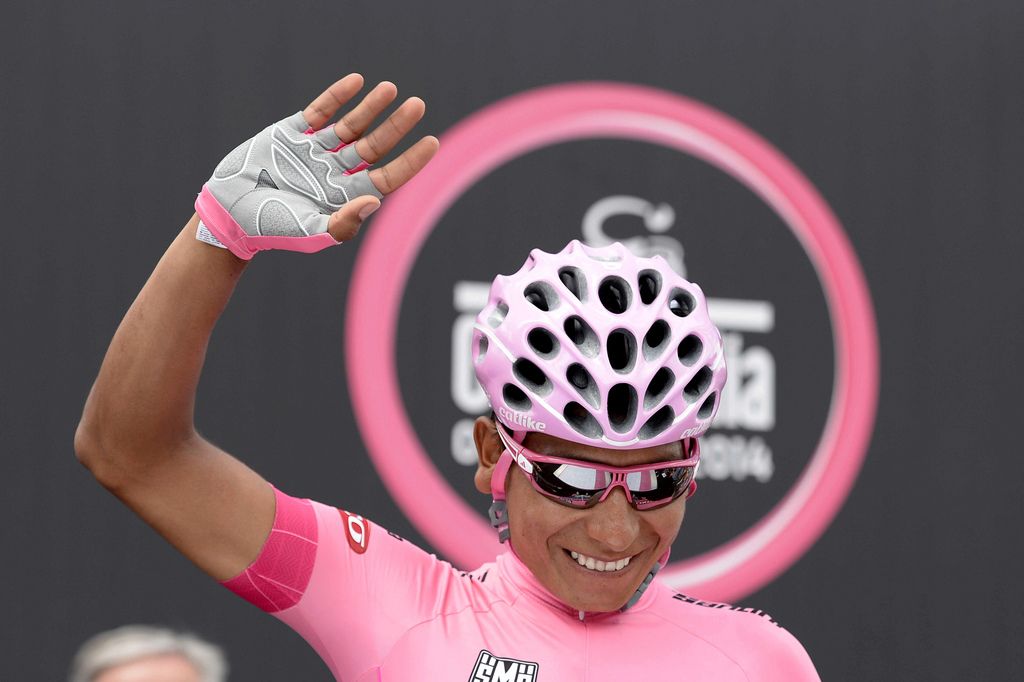 Colombia's Nairo Quintana waves prior to starting the 17th stage of the Giro d'Italia cycling race from from Sarnonico to Vittorio Veneto, Italy, Wednesday, May 28, 2014. Stefano Pirazzi won the 17th stage of the Giro d'Italia on Wednesday, while Nairo Quintana retained the overall leader's pink jersey. Pirazzi, who had led from the breakaway, made his move with little more than a kilometer remaining and edged out Tim Wellens and Jay McCarthy in a sprint at the end of the 204-kilometer (127-mile) stage from Sarnonico to Vittorio Veneto. (AP Photo/Fabio Ferrari)