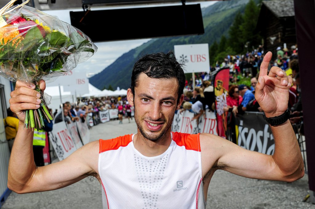 Winner Kilian Jornet Burgada of Spain celebrates after the 41th Sierre-Zinal Long Distance Mountain Running Championship in Chandolin, Switzerland, Sunday, August 10, 2014. Around 4100 runners start in Sierre for a 31 kilometers long race, rise 2200 metres before coming down 800 metres for finishing in Zinal in the Swiss Alps. (KEYSTONE/Olivier Maire)
