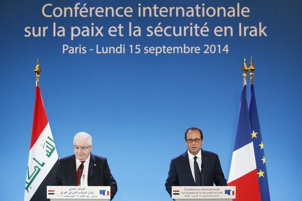 epa04401446 French President Francois Hollande (R) and Iraqi President Fouad Massoum (L) deliver their speeches as part of the International Conference for Peace and Security in Irak, at the Quai d'Orsay in Paris, France, 15 September 2014. French President Francois Hollande and his Iraqi counterpart Fuad Masum are hosting the conference on Iraq's security, which comes after the execution of a third Western hostage by the Islamic State group.  EPA/YOAN VALAT