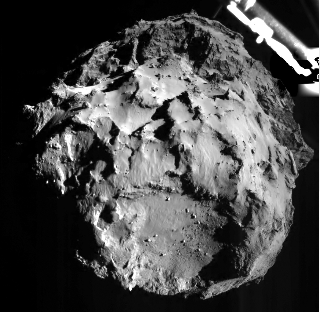 The picture released by the European Space Agency ESA on Wednesday, Nov. 12, 2014 was taken by the ROLIS instrument on Rosetta's Philae lander during descent from a distance of approximately 3 km from  the 4-kilometer-wide (2.5-mile-wide) 67P/Churyumov-Gerasimenko comet.  Hundreds of millions of miles from Earth, the European spacecraft made history Wednesday by successfully landing on the icy, dusty surface of a speeding comet.  (AP Photo/ESA)