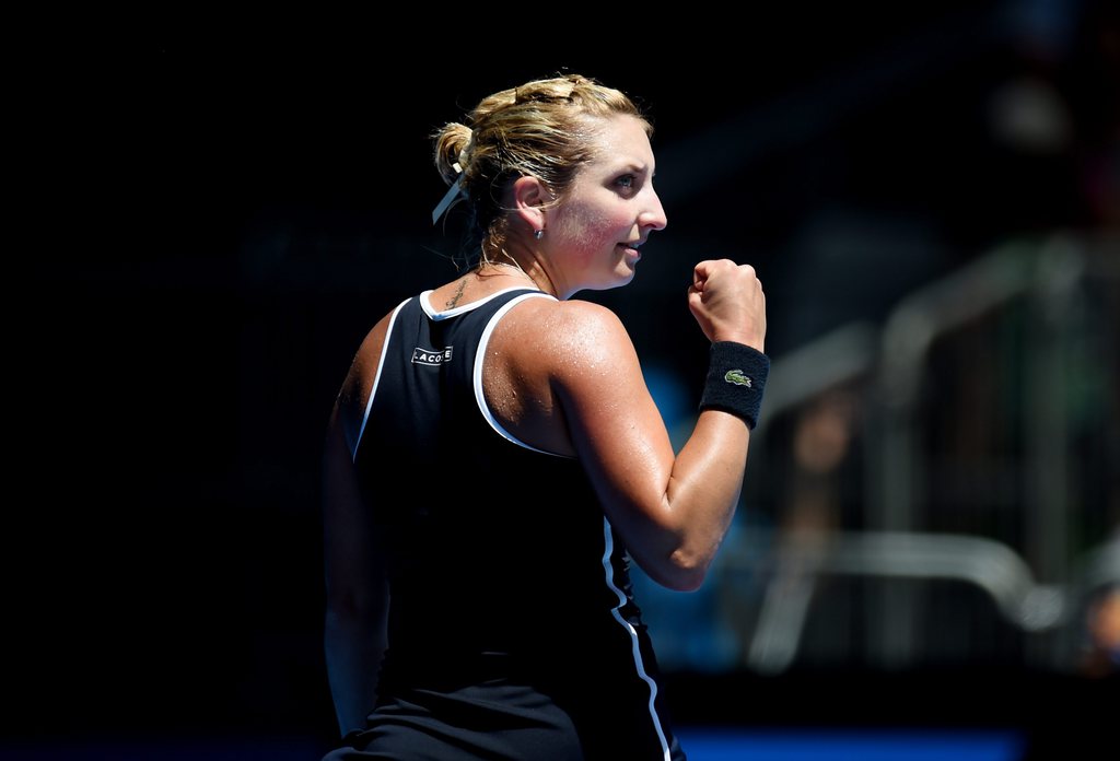 epa04580004 Timea Bacsinszky of Switzerland reacts as she plays against Garbine Muguruza of Spain during their third round match of the Australian Open tennis tournament at Melbourne Park in Melbourne, Australia, 24 January 2015. The Australian Open tennis tournament runs from 19 January until 01 February 2015.  EPA/LUKAS COCH AUSTRALIA AND NEW ZEALAND OUT