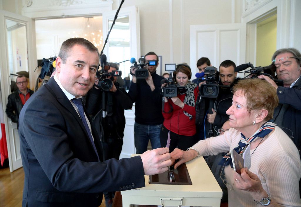 Socialist party candidate Frederic Barbier, casts his ballot as he votes during the second round of the legislative elections in Pont-de-Roide, eastern France, Sunday, Feb. 8, 2015.  France's resurgent far right parties are vying for political gains this weekend, when the National Front is facing the Socialists in an election for a vacant seat in parliament.  (AP Photo)