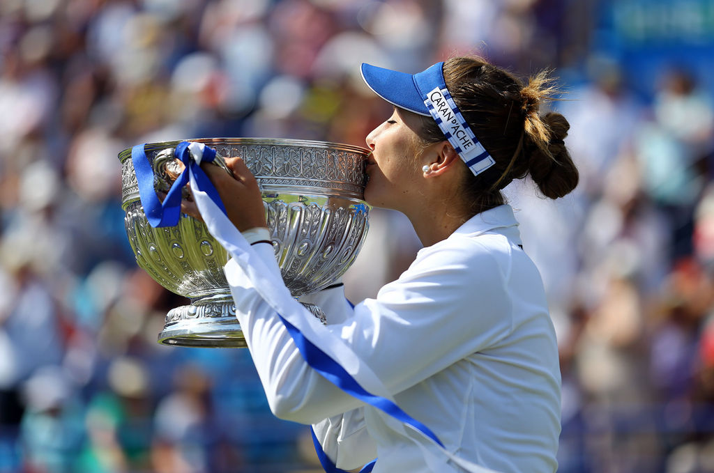 Switzerland's Belinda Bencic kisses the trophy as she celebrates victory in the final against Poland's Agnieszka Radwanska during the women's tennis tournament, Eastbourne, England, Saturday, June 27, 2015. (Gareth Fuller/PA Wire via AP) UNITED KINGDOM OUT, NO SALES, NO ARCHIVE