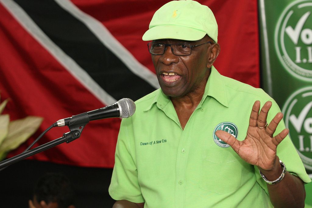 Former FIFA vice president Jack Warner speaks at a political rally in Marabella, Trinidad and Tobago, Wednesday, June 3, 2015. One moment, Jack Warner is on TV telling his countrymen in Trinidad that he fears for his life. An hour later, he's standing on a packed narrow street at a political rally telling supporters that he fears nothing. Indicted by the United States on charges of racketeering, wire fraud and money-laundering, Warner is officially an internationally wanted man, listed as one of Interpol?s most wanted persons. (AP Photo/Anthony Harris)