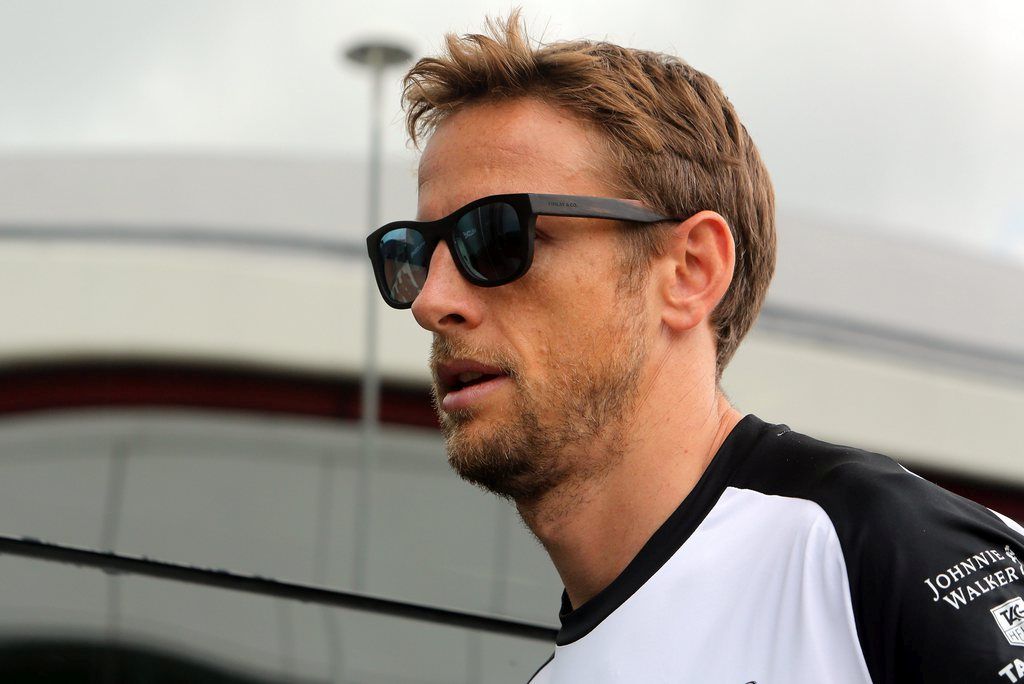epa04827985 British Formula 1 driver with the McLaren Honda team Jenson Button arrives at the paddock prior to the Formula 1 Grand Prix of Great Britain at Silverstone race track, Northamptonshire, Great Britain, Thursday 02 July 2015. The race will take place on Sunday 05 July 2015.  EPA/GEOFF CADDICK