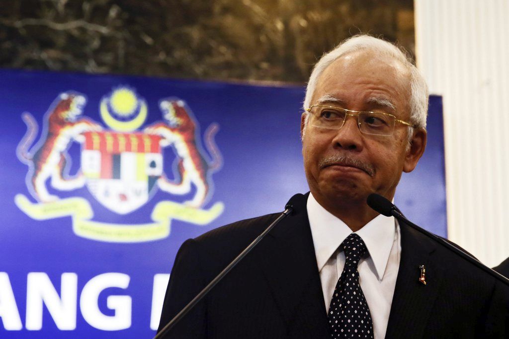 epa04873243 Malaysia Prime Minister Najib Razak reacts during press conference on MH370 at Putra World Trade Centre, Kuala Lumpur, 05 August 2015. Najib said it was confirmed that debris was found on Reunion Island is from MH370 airlines. Beijing-bound flight MH370, with 239 people aboard, disappeared on March 8 last year, about an hour after it took off from Kuala Lumpur International Airport.  EPA/FAZRY ISMAIL