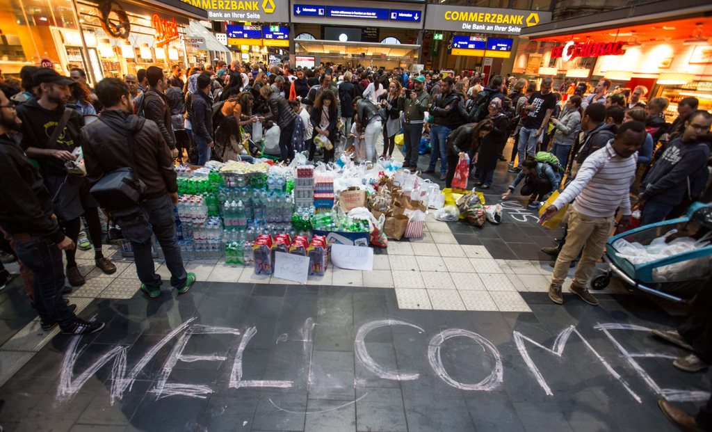 epa04915576 Supplies are set up next to a welcome message in readiness for the arrival of refugees, in Frankfurt's main station, Germany, 05 September 2015. The refugees will be taken to accommodation in Saxony, Saxony-Anhalt and Thuringia Saalfeld by bus. Thousands of refugees streamed into Austria and on to Germany after being allowed to leave Hungary, putting further strain on EU unity as the bloc struggles with its biggest influx of migrants since World War II.  EPA/FRANK RUMPENHORST