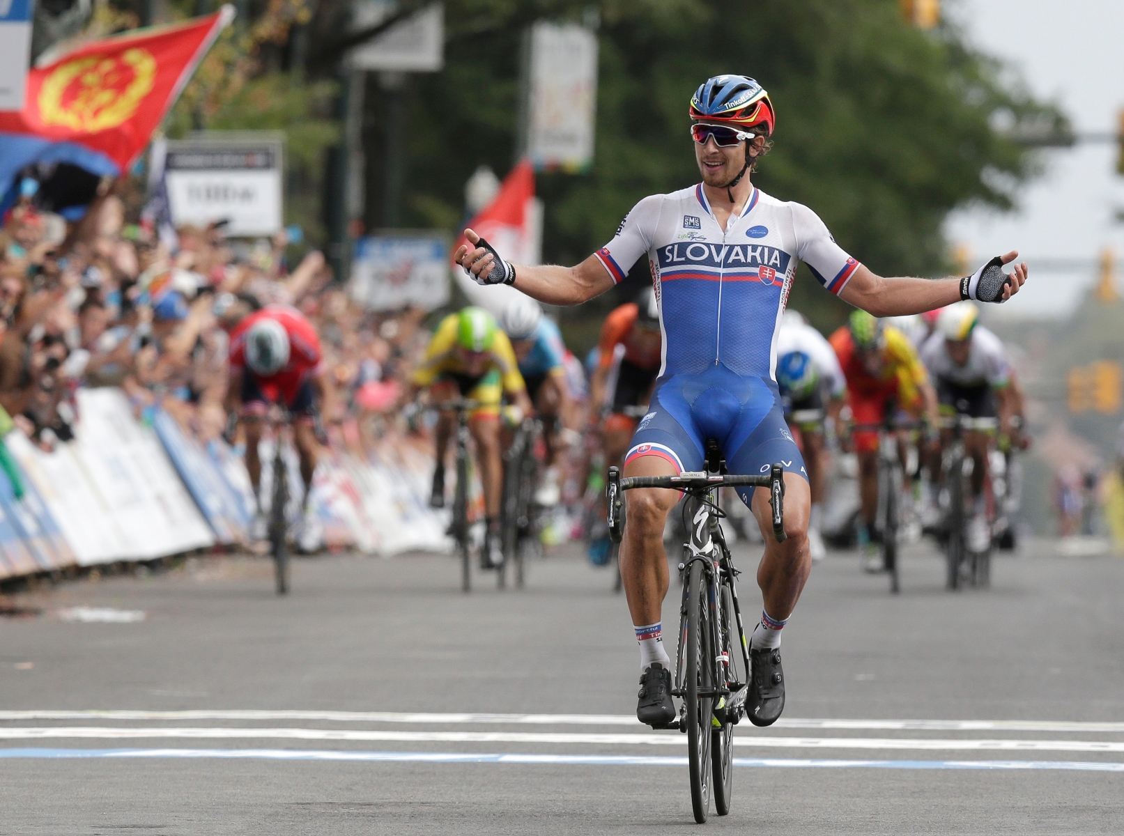Peter Sagan, of Slovakia, reacts as he crosses the finish line to win the men's elite road circuit race in the UCI Road World Championships cycling races in Richmond, Va., Sunday, Sept. 27, 2015. (AP Photo/Gerry Broome) World Championships Cycling