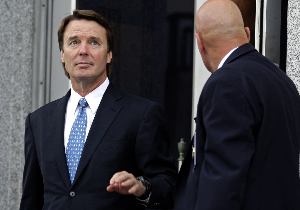 FILE - In this May 8, 2012 file photo, former presidential candidate and Sen. John Edwards, left, leaves a federal courthouse in Greensboro, N.C. Lawyers for Edwards are set to begin presenting his defense at the former presidential contender's conspiracy and campaign-finance trial on Monday, May 14, 2012. (AP Photo/Chuck Burton, File) === MAY 8, 2012 FILE PHOTO === 