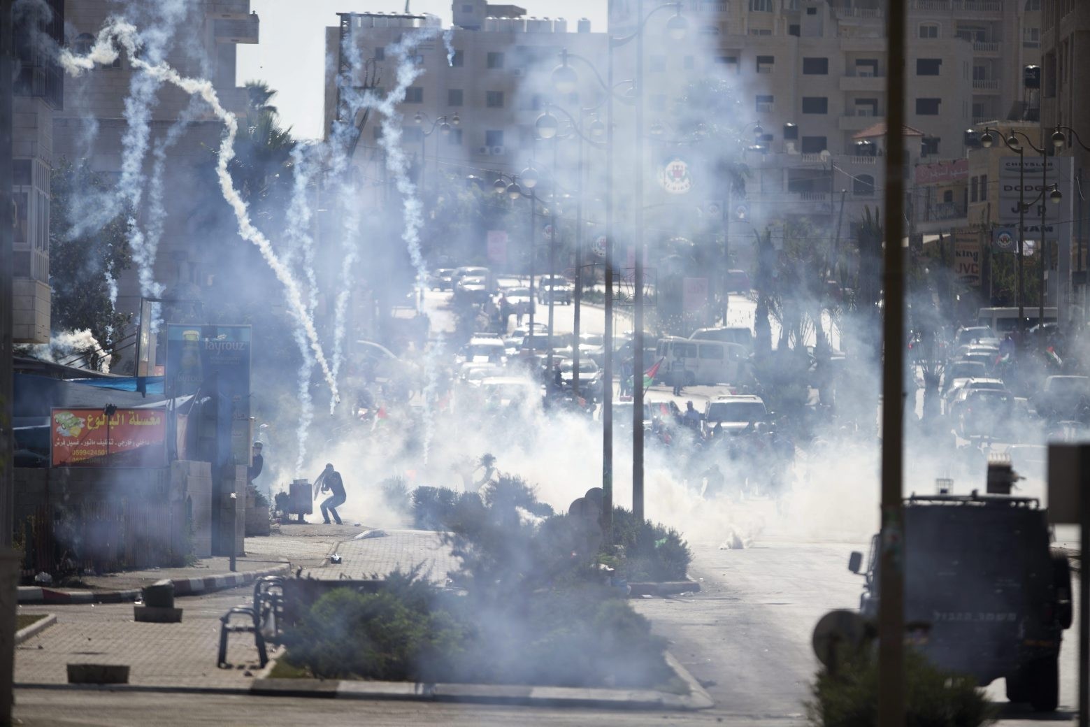 Israeli troops fire tear gas during clashes with Palestinian demonstrators near Ramallah, West Bank, Friday, Oct. 16, 2015. Tensions and violence have been mounting in recent weeks, in part fueled by Palestinian fears that Israel is trying to expand its presence at a major Muslim-run shrine in Jerusalem, a claim Israel has denied. (AP Photo/Majdi Mohammed) Mideast Israel Palestinians