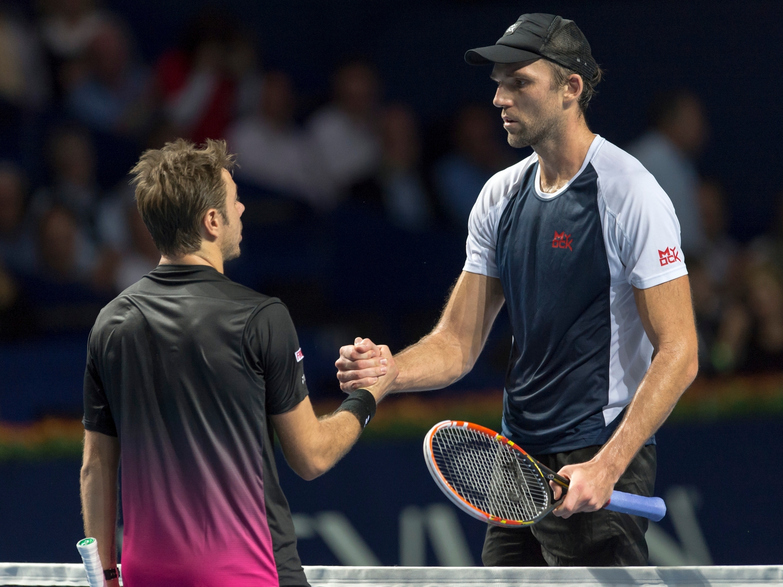 Switzerland's Stan Wawrinka, left, congratulates Croatia's Ivo Karlovic, right, after their first round match at the Swiss Indoors tennis tournament at the St. Jakobshalle in Basel, Switzerland, on Wednesday, October 28, 2015. (KEYSTONE/Georgios Kefalas) SWITZERLAND TENNIS SWISS INDOORS