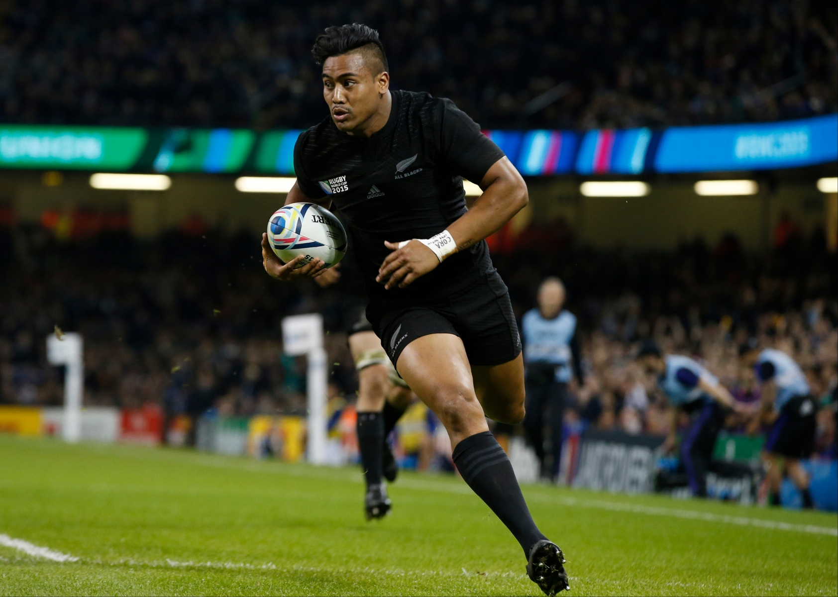 FILE - In this file photo dated Saturday, Oct. 17, 2015, New Zealand's Julian Savea scores a try during the Rugby World Cup quarterfinal match between New Zealand and France at the Millennium Stadium, Cardiff.  Stunning skill by winger Julian Savea bought an audible gasp from fans around Millennium Stadium. (AP Photo/Alastair Grant, FILE) Britain Rugby WCup Top Tries