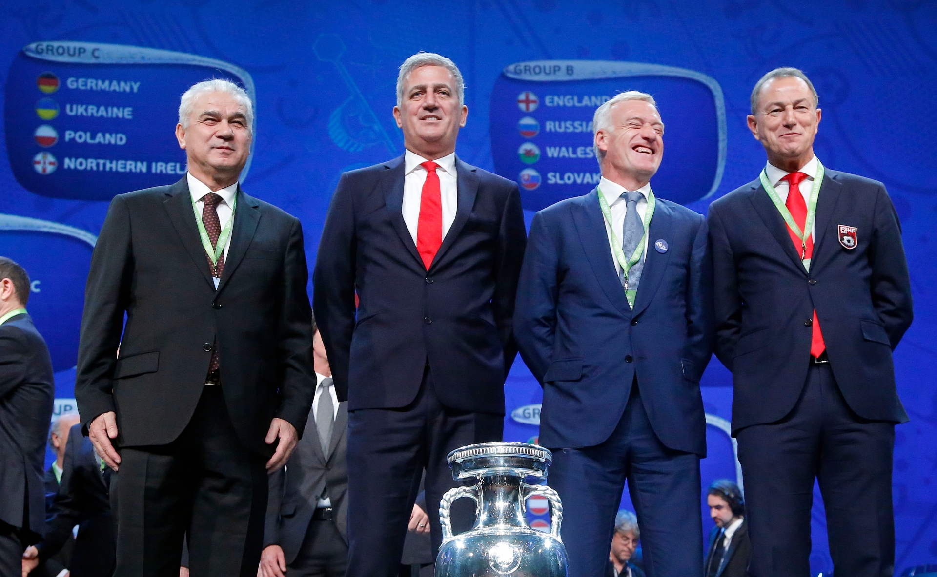 The coaches of teams drawn in group A, from left: Romanian coach Anghel Iordanescu, Vladimir Petkovic, the coach of Switzerland, French soccer team coach Didier Deschamp and Gianni de Biasi, the coach of Albania pose for a photo after the Euro 2016 soccer championships draw in Paris Saturday, Dec. 12, 2015.  (AP Photo/Michel Euler) France Euro 2016 Draw Soccer