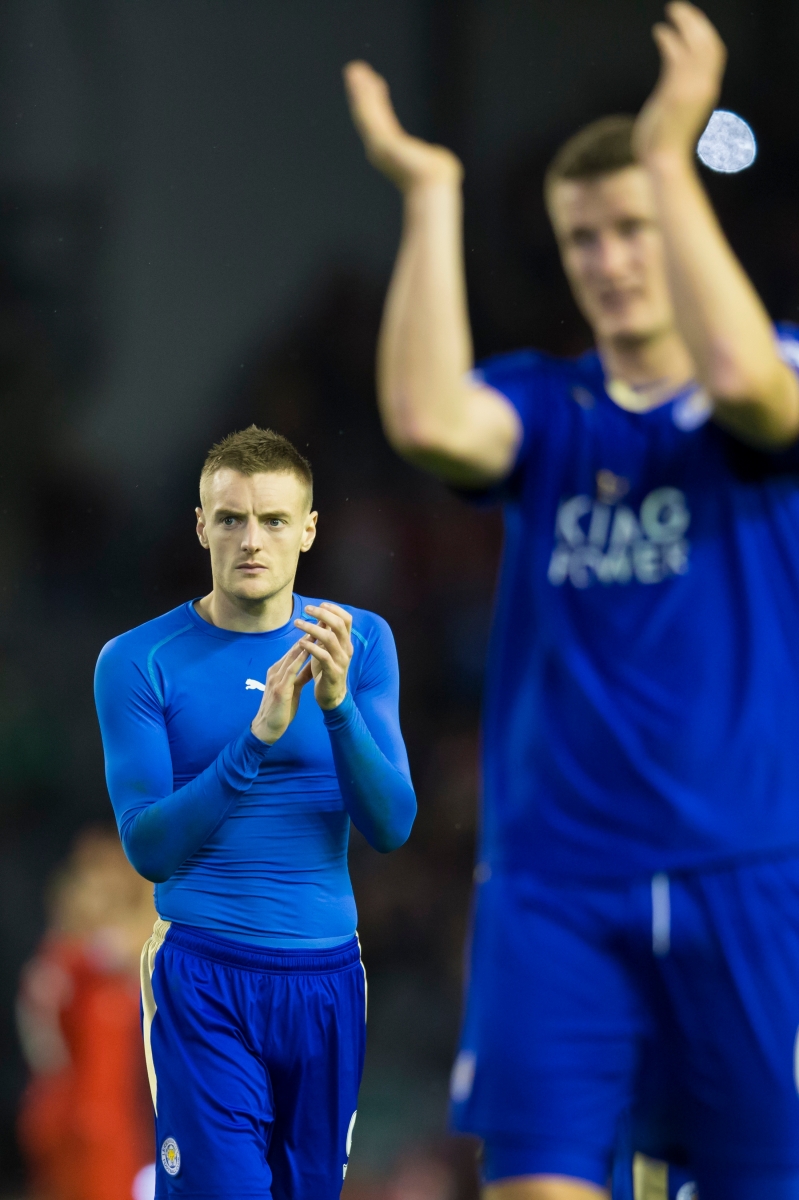 Leicester City's Jamie Vardy, left, applauds supporters after his team's 1-0 loss in the English Premier League soccer match between Liverpool and Leicester City at Anfield Stadium, Liverpool, England, Saturday, Dec. 26, 2015. (AP Photo/Jon Super)     Britain Soccer Premier League