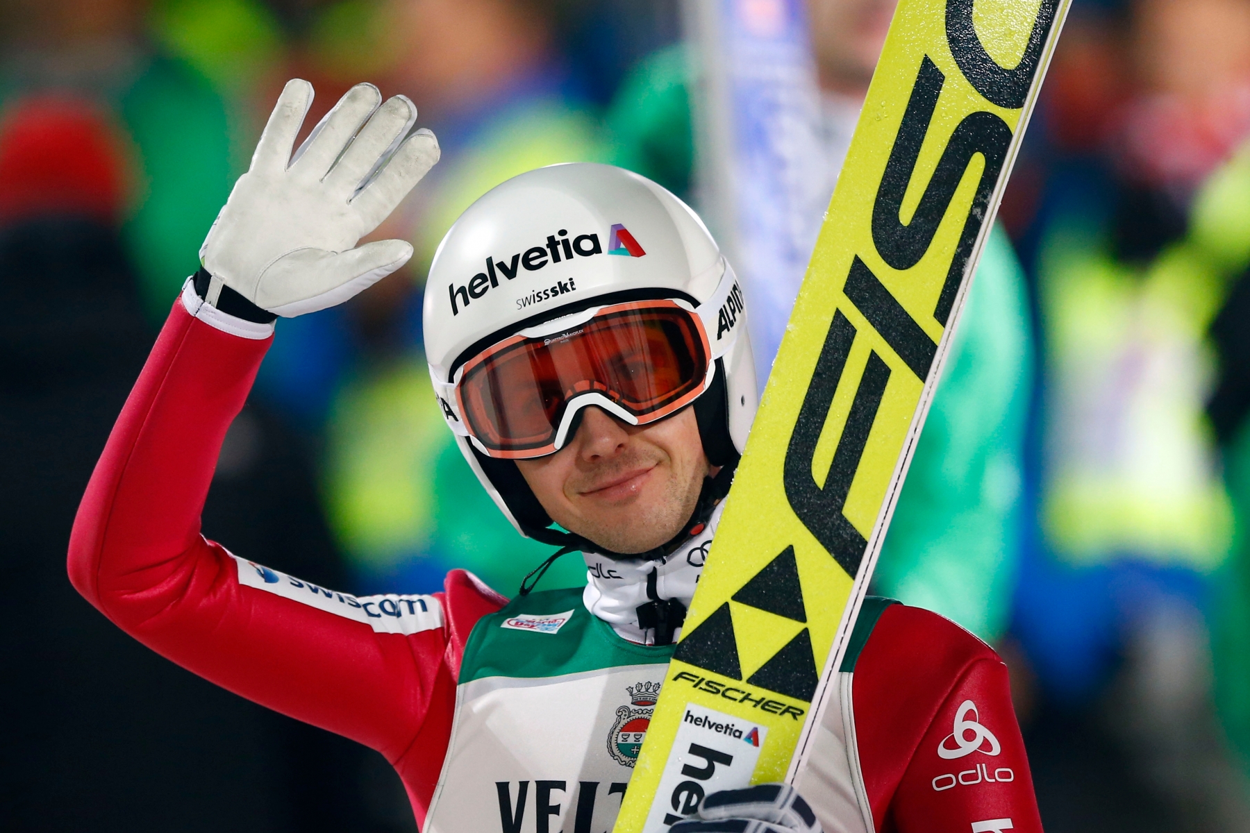 Switzerland's Simon Ammann waves to supporters after his first competition jump at the first stage of the 64. four hills ski jumping tournament in Oberstdorf, Germany,  Tuesday, Dec. 29, 2015. (AP Photo/Matthias Schrader) Germany Ski Jumping Four Hills