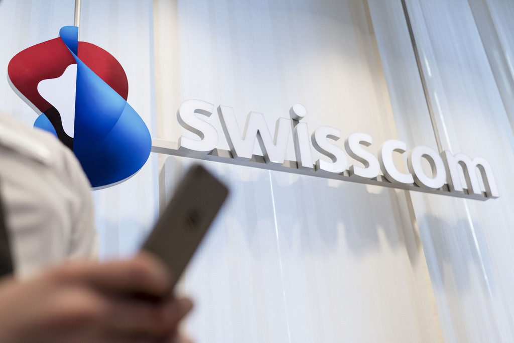 The Swisscom logo pictured in a Swisscom Shop of the telecommunications provider Swisscom AG on Bubenbergplatz Square in Bern, Switzerland, on July 2, 2015. (KEYSTONE/Christian Beutler)