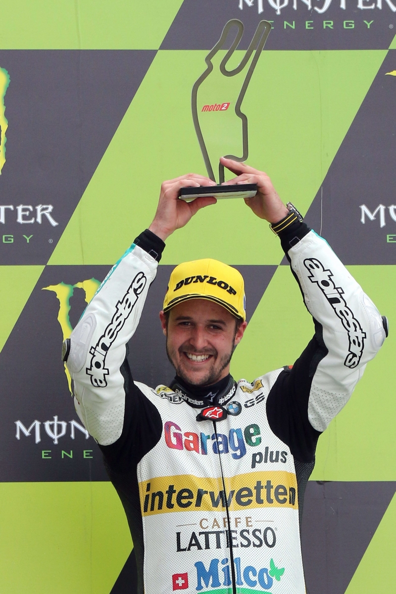 epa05294809 Swiss Moto 2 rider Thomas Luethi of garage Plus Interwetten celebrates his third place on the podium during the Moto2 race of the French Motorcycling Grand Prix at Le Mans race track, Le Mans, France, 08 May 2016.  EPA/EDDY LEMAISTRE FRANCE MOTORCYCLING GRAND PRIX