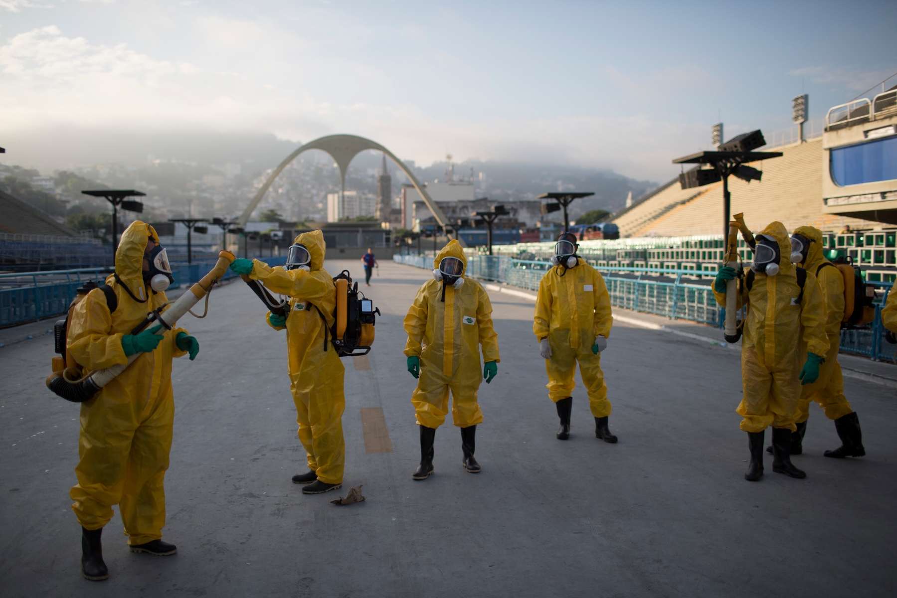 FILE - This is a  Tuesday, Jan. 26, 2016  file photo of health workers as they get ready to spray insecticide to combat the Aedes aegypti mosquitoes that transmits the Zika virus under the bleachers of the Sambadrome in Rio de Janeiro,  which will be used for the Archery competition in the 2016 summer games. With the opening ceremony just over two months away, Olympic leaders have plenty of challenges to discuss this week when they meet for the last time before gathering in Rio de Janeiro on the eve of South AmericaÌs first games. (AP Photo/Leo Correa, File) Brazil Olympics IOC Meeting