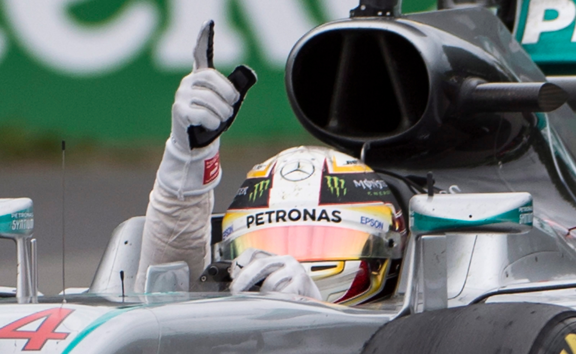 Mercedes driver Lewis Hamilton, of Britain, signals after winning the Canadian Grand Prix auto race in Montreal, Sunday, June 12, 2016. (Graham HUghes/The Canadian Press via AP) MANDATORY CREDIT F1 Canada Grand Prix Auto Racing