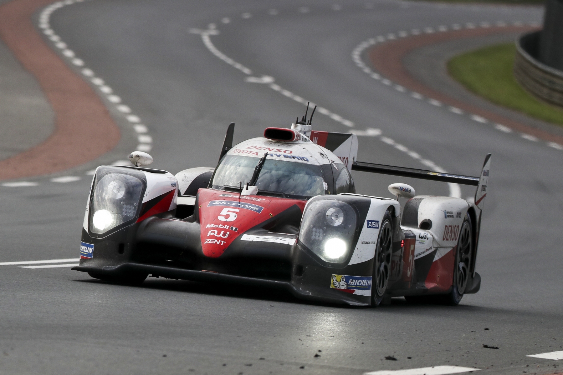 The Toyota TS050 Hybrid No5 of the Toyota Gazoo Racing driven by Sebastien Buemi of Switzerland, Anthony Davidson of Great Britain and Kazuki Nakajima of Japan in action during the 84th 24-hour Le Mans endurance race, in Le Mans, western France, Sunday, June 19, 2016. (AP Photo/Kamil Zihnioglu) France Le Mans 24h Auto Racing