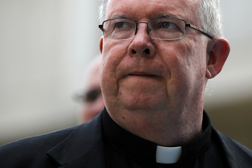 Monsignor William Lynn walks to the Criminal Justice Center, Tuesday, June 19, 2012, in Philadelphia. Lynn is the first Roman Catholic church official in the U.S. ever charged with child endangerment, for allegedly keeping co-defendants former priest Edward V. Avery and the Rev. James J. Brennan, and other accused predators, in ministry. (AP Photo/Matt Rourke)