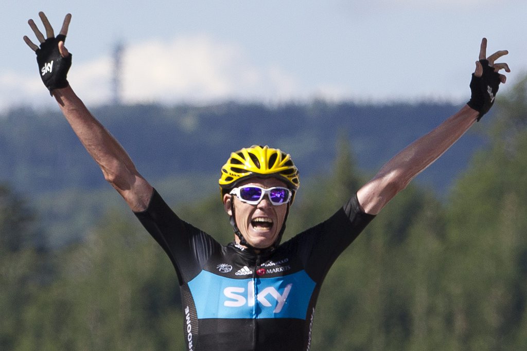 Christopher Froome of Britain crosses the finish line to win the seventh stage of the Tour de France cycling race over 199 kilometers (123.6 miles) with start in Tomblaine and finish in La Planche des Belles Filles, France, Saturday July 7, 2012. (AP Photo/Peter Dejong)
