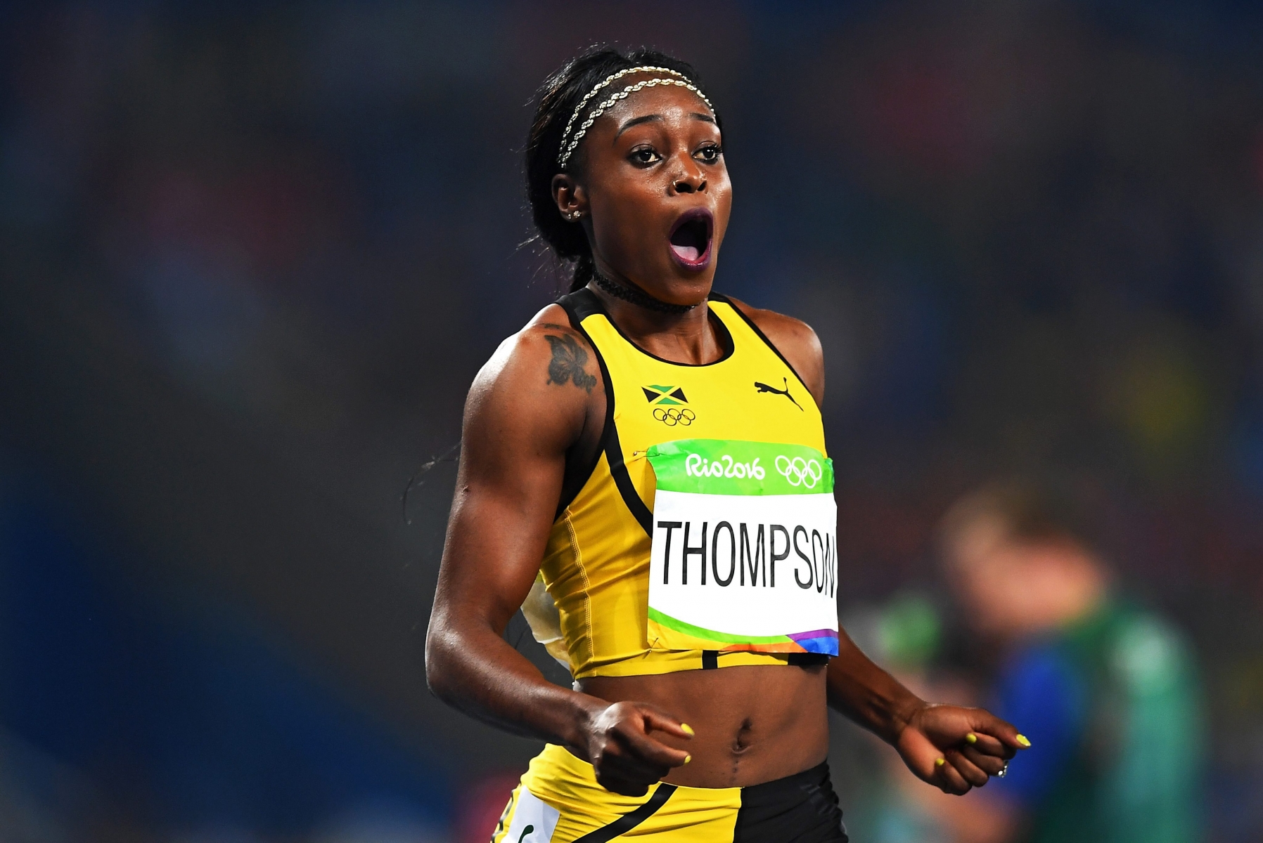 epa05495186 Elaine Thompson of Jamaica celebrates after winnig the women's 200m final of the Rio 2016 Olympic Games Athletics, Track and Field events at the Olympic Stadium in Rio de Janeiro, Brazil, 17 August 2016  EPA/LUKAS COCH   AUSTRALIA AND NEW ZEALAND OUT BRAZIL RIO 2016 OLYMPIC GAMES