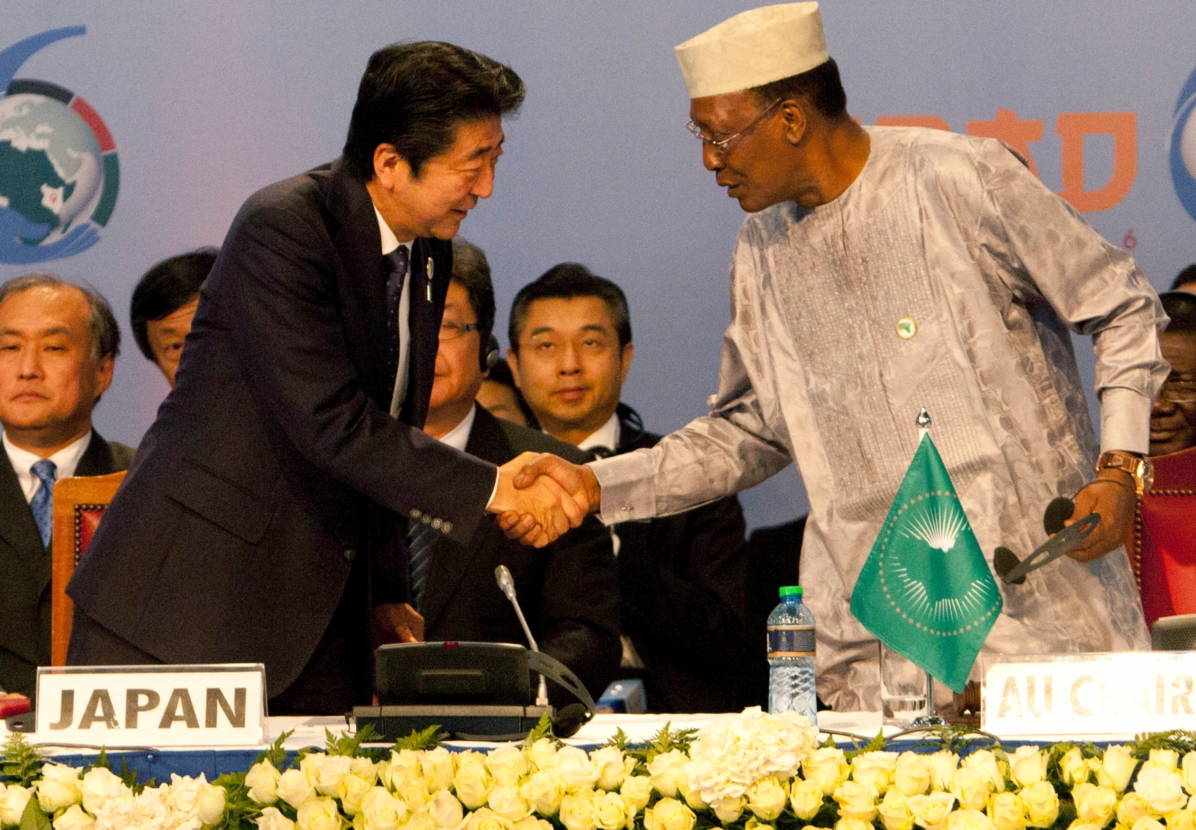 Japanese Prime Minister Shinzo Abe, left, shakes hands with Chad's President Idriss Deby during the opening of Tokyo International Conference on African Development (TICAD) at the Kenyatta International Conference Centre in Nairobi, Kenya, Saturday, Aug. 27, 2016. (AP Photo/Sayyid Abdul Azim) Kenya Japan TICAD