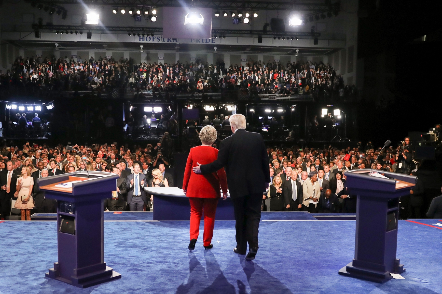 Democratic presidential nominee Hillary Clinton and Republican presidential nominee Donald Trump walk across the stage after the presidential debate at Hofstra University in Hempstead, N.Y., Monday, Sept. 26, 2016. (Joe Raedle/Pool via AP) APTOPIX Campaign 2016 Debate