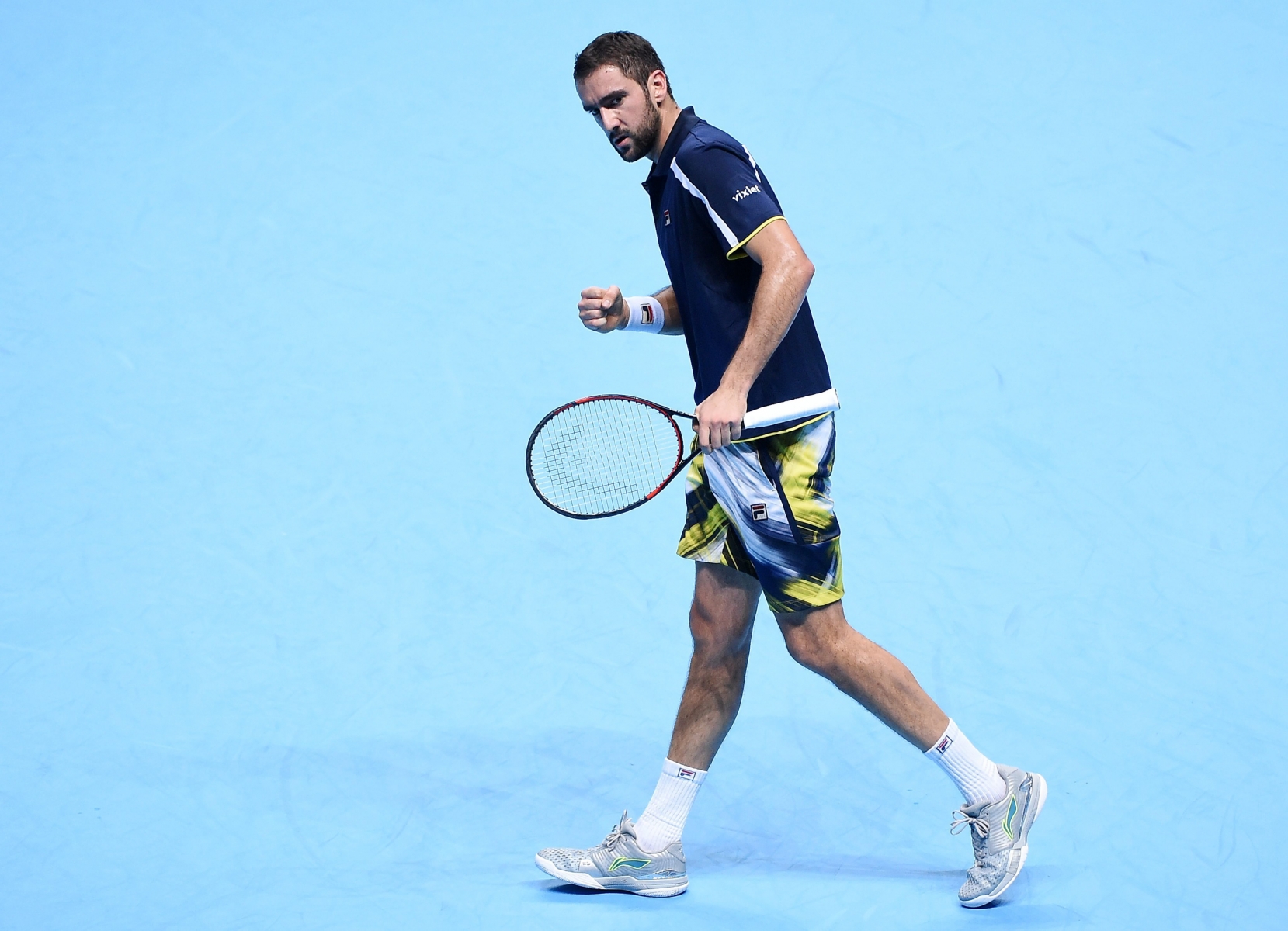 epa05631643 Marin Cilic of Croatia reacts after breaking Britain's Andy Murray's serve during their singles group stage match at the ATP World Tour finals tennis tournament at the O2 Arena in London, Britain, 14 November 2016.  EPA/ANDY RAIN BRITAIN TENNIS ATP WORLD TOUR FINALS