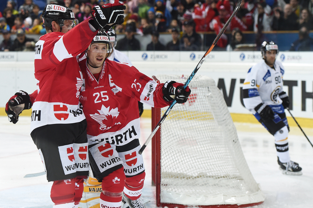 Canadas Nick Spaling and scorer Cory Emmerton celebrate after scoring 3-1 during the final game between Team Canada and Switzerlands HC Lugano at the 90th Spengler Cup ice hockey tournament in Davos, Switzerland, Saturday, December 31, 2016. (KEYSTONE/Melanie Duchene)