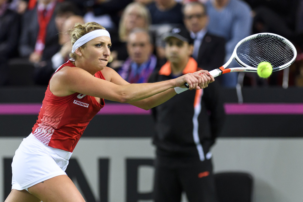 Swiss tennis players Timea Bacsinszky, returns a ball to French tennis player Alize Cornet, during the first single match of the Fed Cup World Group first round match between Switzerland and France, at Palexpo, in Geneva, in Geneva, Saturday 11 February 2017. The Fed Cup World Group first round Switzerland vs France will take place from 11 to February 12. (KEYSTONE/Martial Trezzini)