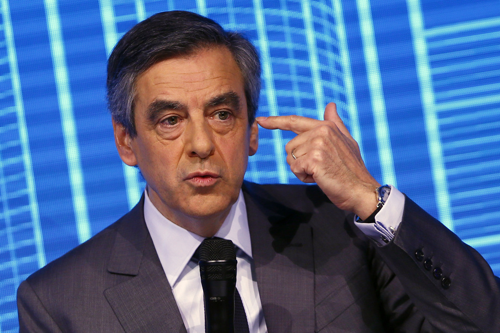 Francois Fillon, candidate for the 2017 French presidential elections of the right-wing Les Republicains (LR) party participates to the Construction Forum debate "reinvest France" ("Reinvestissons la France") at Carrousel du Louvre in Paris, Thursday, Feb. 23, 2017. (AP Photo/Francois Mori)