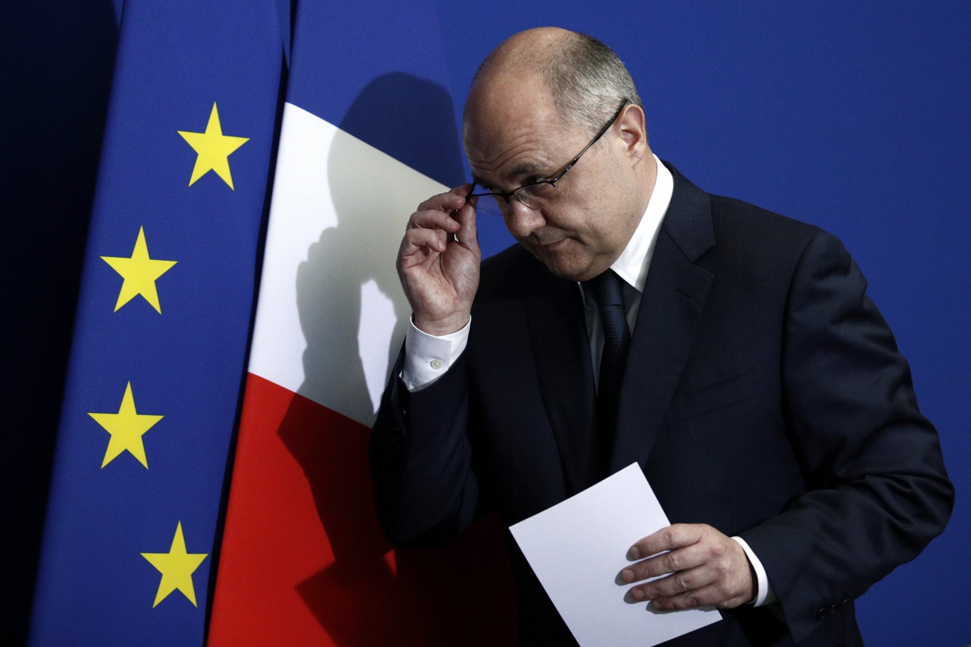 epa05862121 French Interior Minister Bruno Le Roux reacts after delivering a speech to announce his resignation at the Prefecture of Bobigny, near Paris, France, 21 March 2017. Bruno Le Roux resigned over reports he hired his two daughters as parliamentary assistants for summer jobs. A preliminary inquiry has been opened by the financial prosecutor's office on 21 March.  EPA/YOAN VALAT FRANCE POLITICS GOVERNMENT LE ROUX RESIGNATION