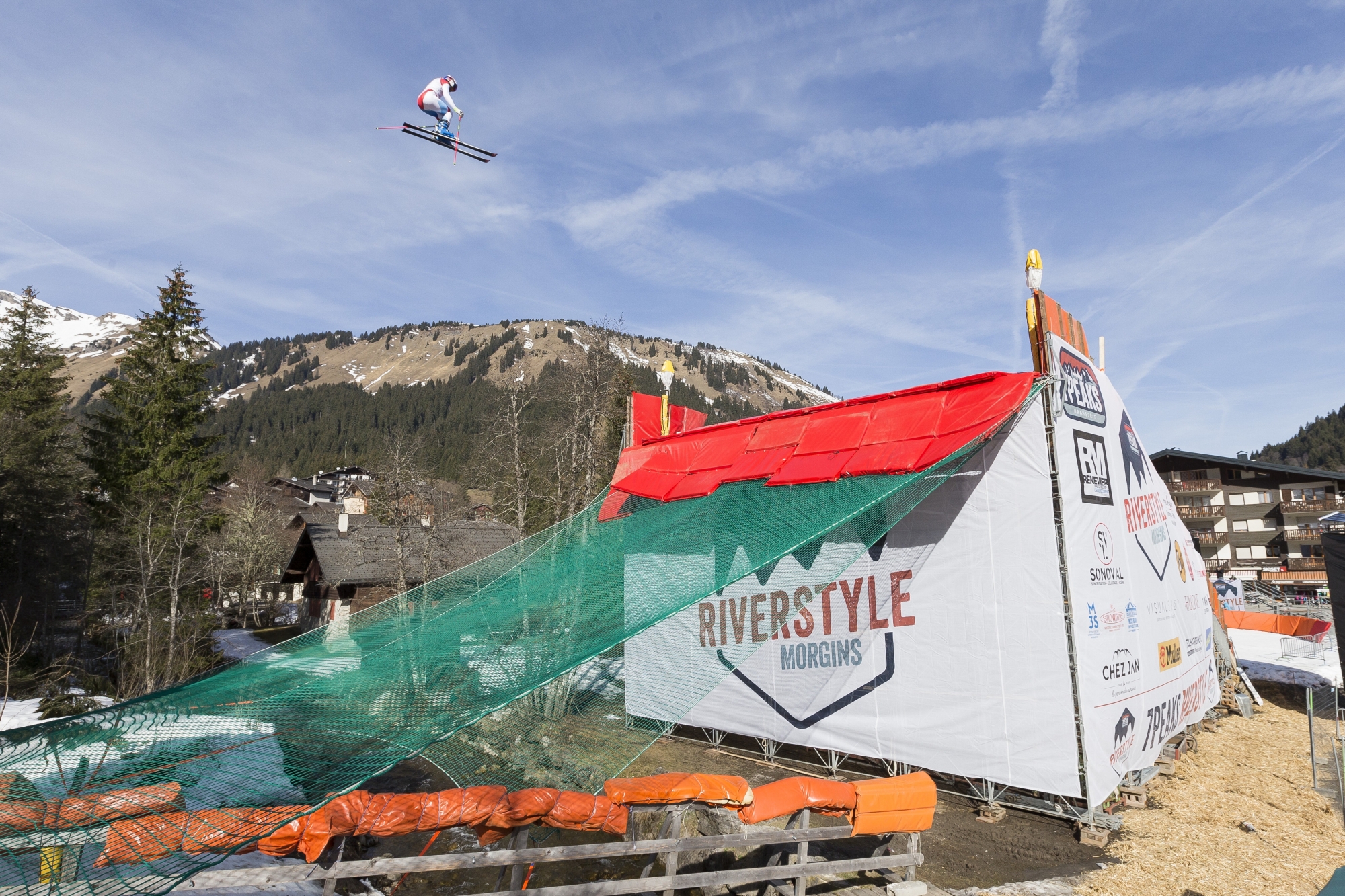 Former ski alpin racer and 2010 Olympic champion Swiss Didier Defago leaps over the river Vieze during the 2nd edition of the 7Peaks Riverstyle in Morgins, Switzerland Thursday, March 30, 2017. The 7Peaks Riverstyle is a freestyle ski competition in the Swiss aples. (KEYSTONE/Cyril Zingaro) SWITZERLAND CP 7PEAKS RIVERSTYLE
