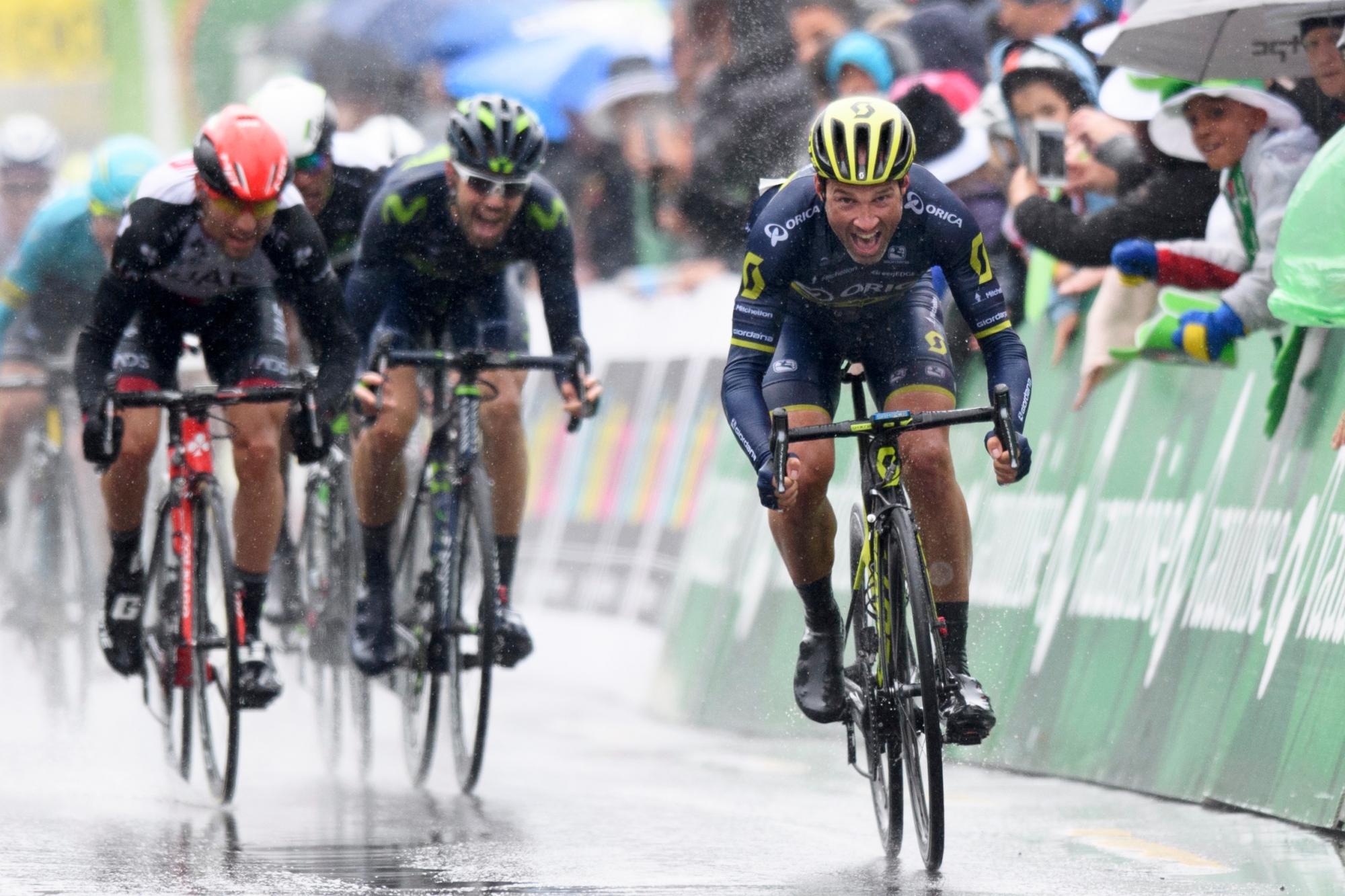 Michael Albasini, right, from Switzerland of team Orica-Scott cross the finish line to win the first stage, a 173.3 km race between Aigle and Champery at the 71th Tour de Romandie UCI ProTour cycling race in Champery, Switzerland, Wednesday, April 26, 2017. (KEYSTONE/Laurent Gillieron) SWITZERLAND CYCLING TOUR DE ROMANDIE